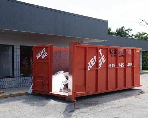 National Rent-all bin in front of building