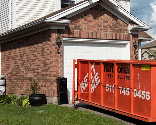 National Rent-all bin in front of house